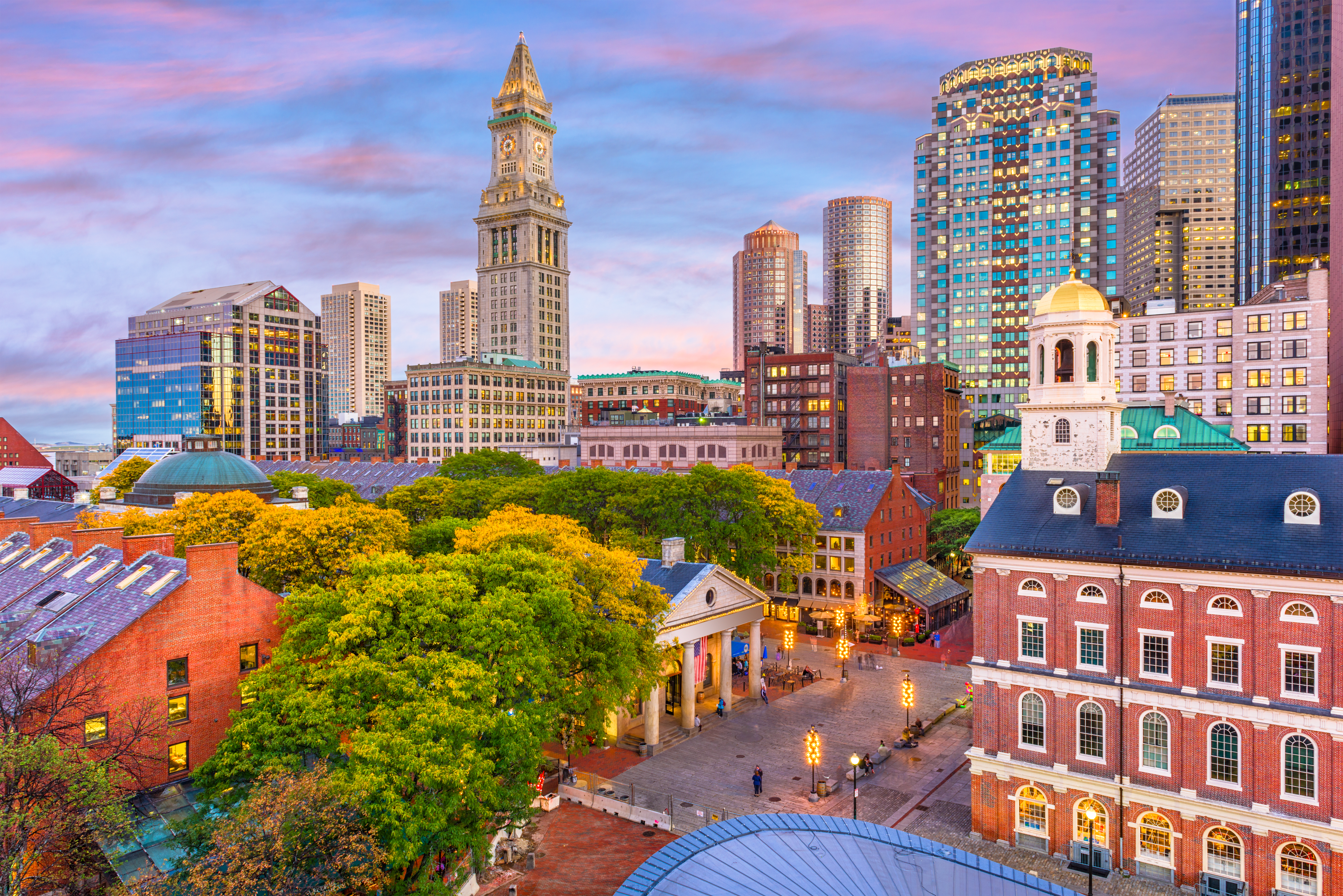 Aerial view of Faneuil Hall Marketplace and Boston at dusk